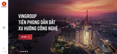 Vingroup corporate website on laptop and mobile
